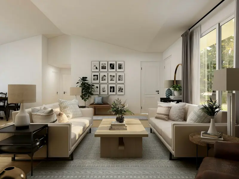 Tidy, bright living room with cream sofas