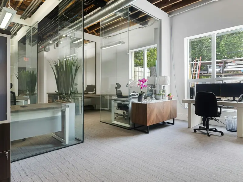 Clean, bright small office with glass-walled rooms